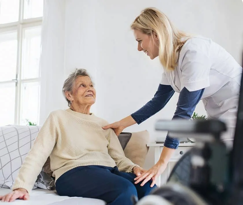 Caregiver assisting client at home
